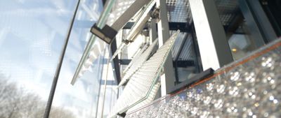 Close-up of Lumiduct solar panels in a glass façade